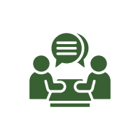 Two people talking at a table icon.